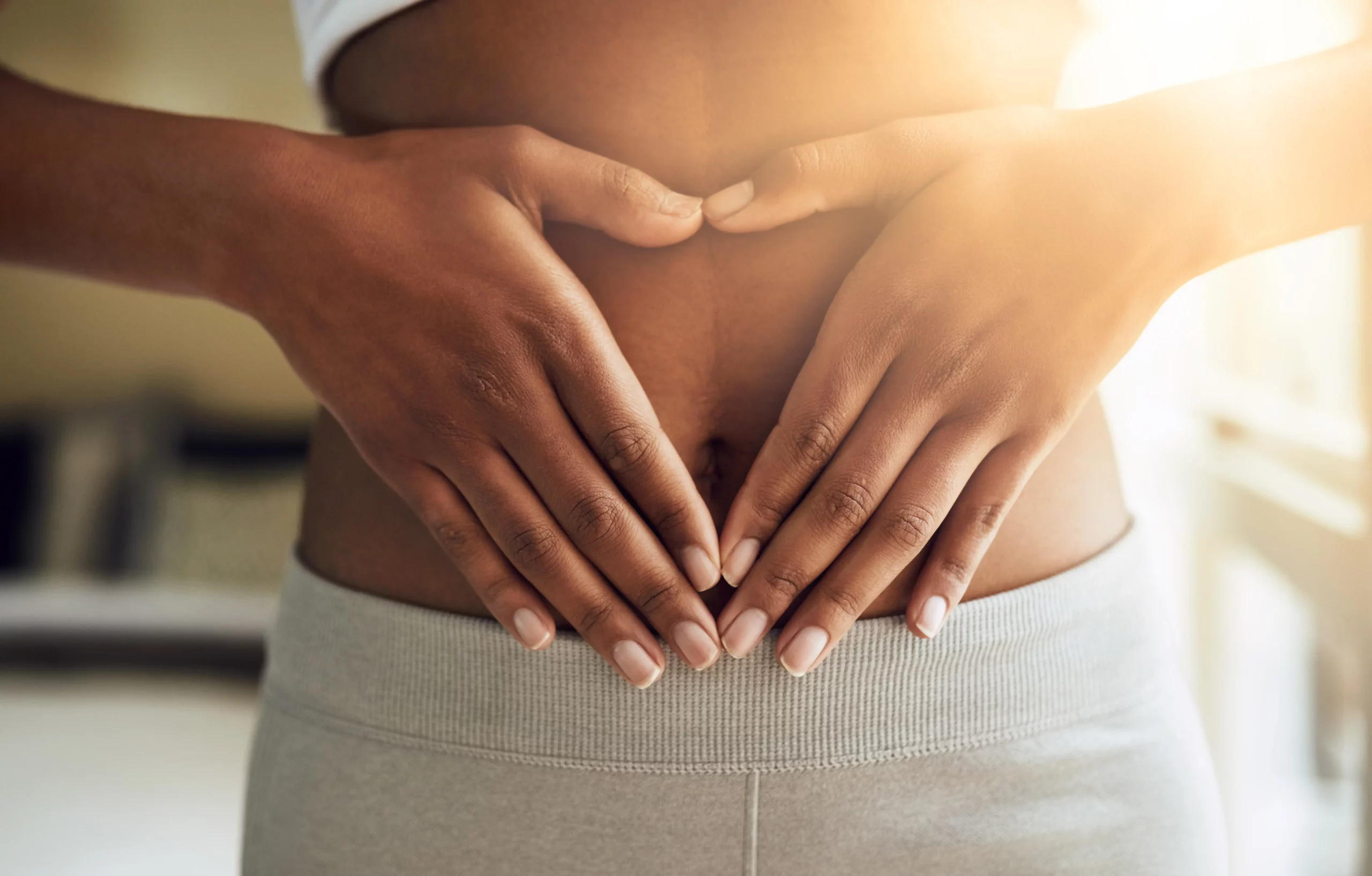 Gut Health and Allergy Testing: hands forming heart shape on stomach